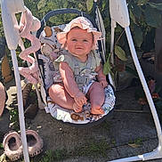 Remi-Mae is registered to the contest to win money with this photo: baby, child, swing, baby_swing, hat, pink_hat, outdoor, sunlight, grass, plants, concrete, footwear, shoes, toy, baby_toy, greenery, playful, cute, summer, nature