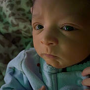 Freya joined the competition — help win amazing prizes! baby, infant, close_up, face, hand, clothing, blanket, sleepwear, indoor, portrait, newborn, expression, cute, young_child, soft_light, warm, skin, person, babywear, resting