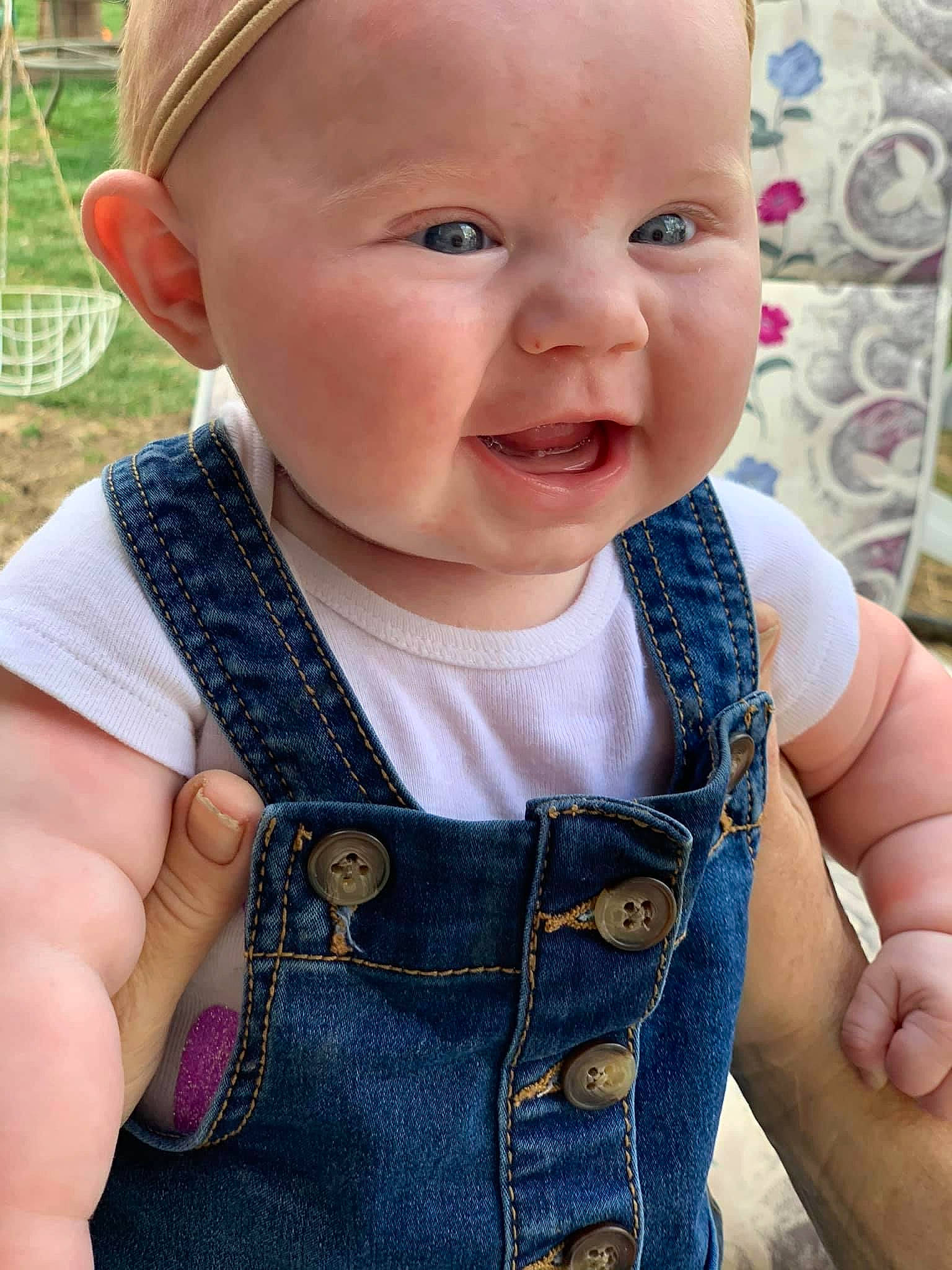 Kinlee is registered to the contest to win money with this photo: azure, baby, baby_toddler_clothing, cheek, eye, face, finger, hand, iris, lip, neck, organ, outerwear, person, pink, product, skin, sleeve, smile, textile