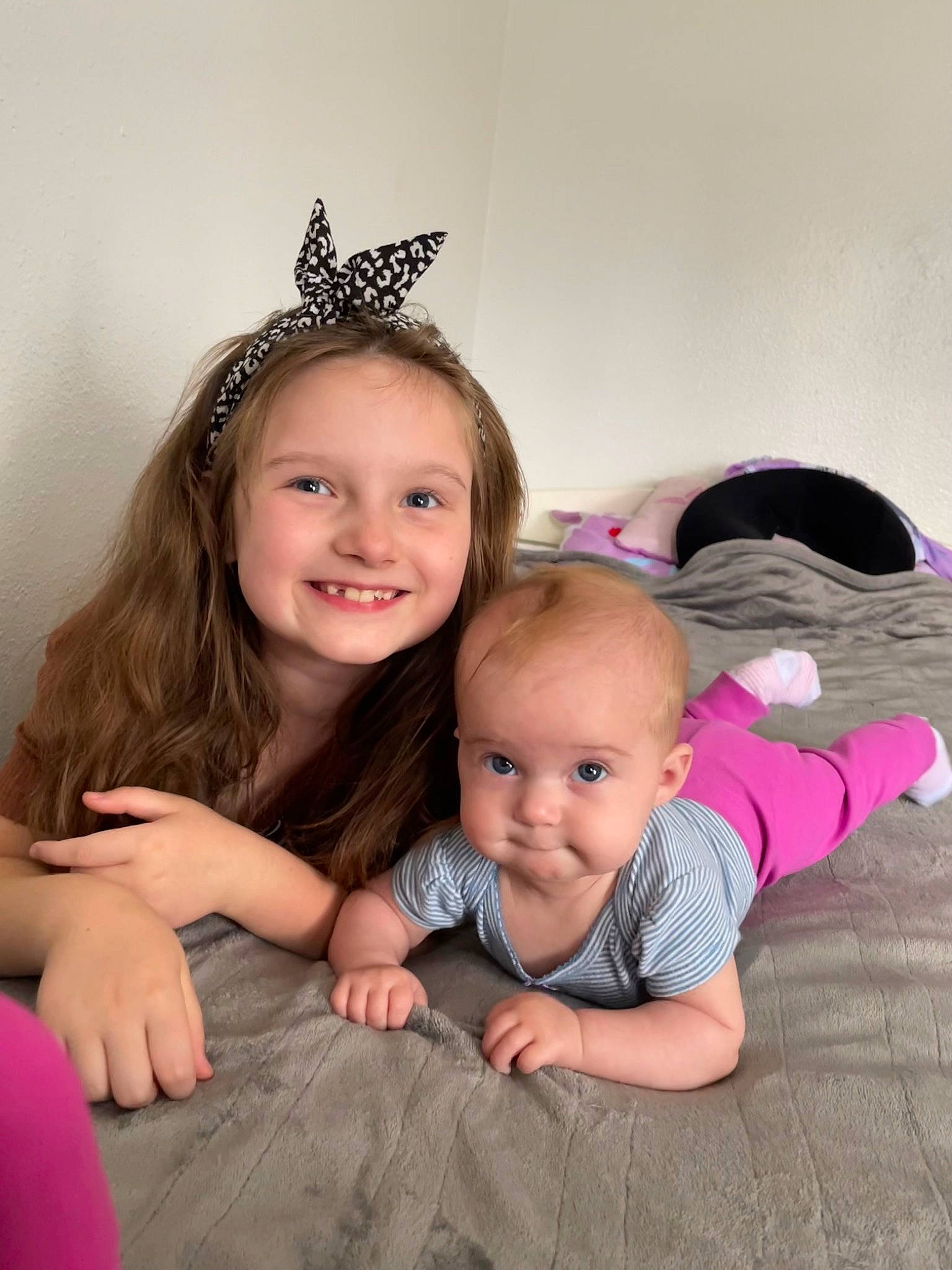 Paizley is registered to the contest to win money with this photo: baby_toddler_clothing, child, clothing, comfort, event, eye, facial_expression, flash_photography, flooring, fun, happy, head, iris, joy, people, person, sitting, skin, smile, t_shirt