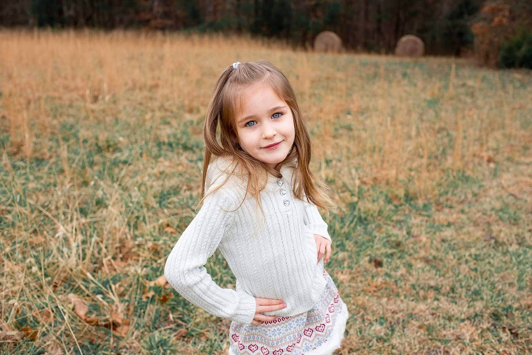 Presley is registered to the contest to win money with this photo: child, dress, flash_photography, grass, grassland, happy, joy, landscape, leaf, mammal, meadow, natural_landscape, nature, people, people_in_nature, person, plant, smile, summer, sunlight