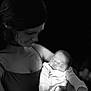 Braxton is registered to the contest to win money with this photo: arms, baby, black_and_white, calm, caring, closeup, dark_background, face, holding, infant, love, mother, newborn, peaceful, person, portrait, sleeping, soft_light, tender, woman