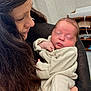 Braxton joined the competition — help win amazing prizes! woman, baby, newborn, sleeping, holding, indoor, striped_clothing, long_hair, person, cozy, peaceful, portrait, care, love, mother, infant, resting, close_up, human, comfort