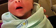 Braxton joined the competition — help win amazing prizes! newborn, baby, infant, blanket, wrapped, indoor, furniture, chair, table, person, face, head, soft, cozy, child, young, expression, curious, clothing, holding