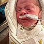 baby, blanket, child, closeup, cute, face, fragile, healthcare, indoors, infant, lion_print, medical, nasal_tube, newborn, person, resting, sleeping, soft, tender, wrapped