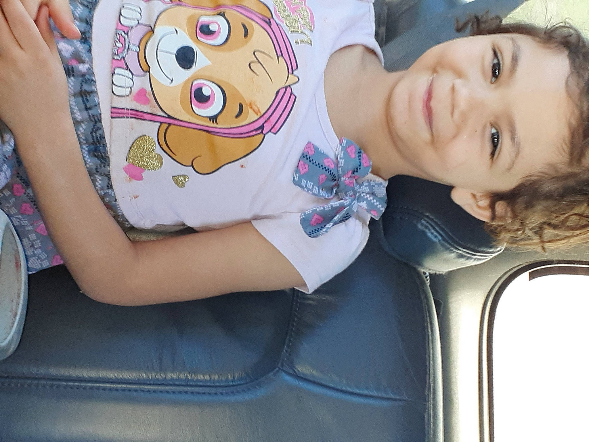 Kyera is registered to the contest to win money with this photo: auto_part, car_seat, chair, child, comfort, couch, eye, face, fun, happy, head, joy, leisure, motor_vehicle, mouth, person, sitting, smile, t_shirt, thigh