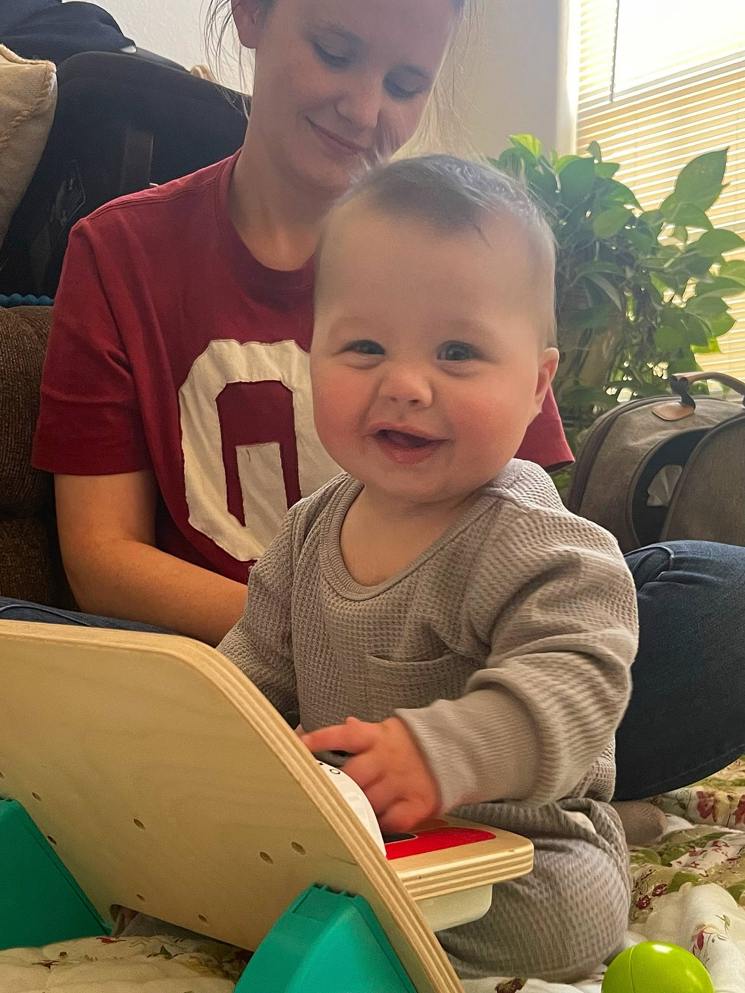 Liam is registered to the contest to win money with this photo: child, eye, face, facial_expression, grass, hairstyle, happy, head, houseplant, human, joy, organ, person, photograph, plant, product, skin, smile, standing, toddler