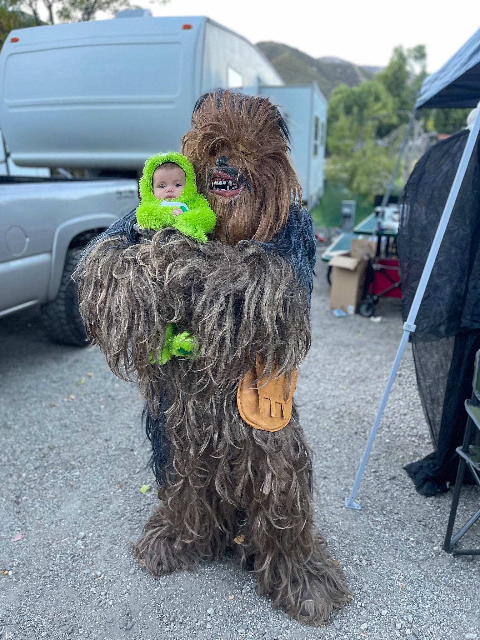 Adelina is registered to the contest to win money with this photo: art, automotive_tire, car, carnivore, companion_dog, dog, dog_breed, event, fur, grass, light_commercial_vehicle, motor_vehicle, person, plant, sky, sporting_group, tent, tire, truck, van