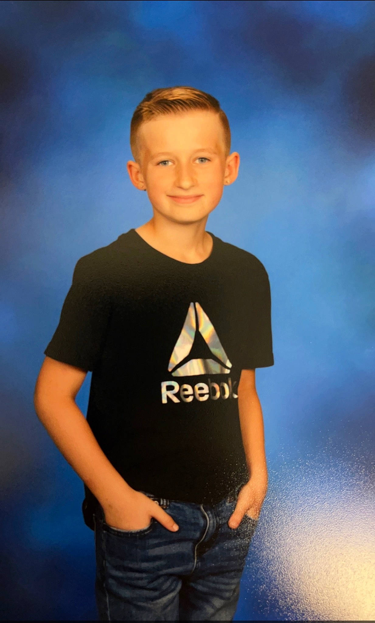 Riley is registered to the contest to win money with this photo: cool, elbow, electric_blue, eyewear, face, flash_photography, forehead, gesture, happy, head, human_body, jaw, jeans, joy, muscle, neck, person, shoulder, sky, sleeve