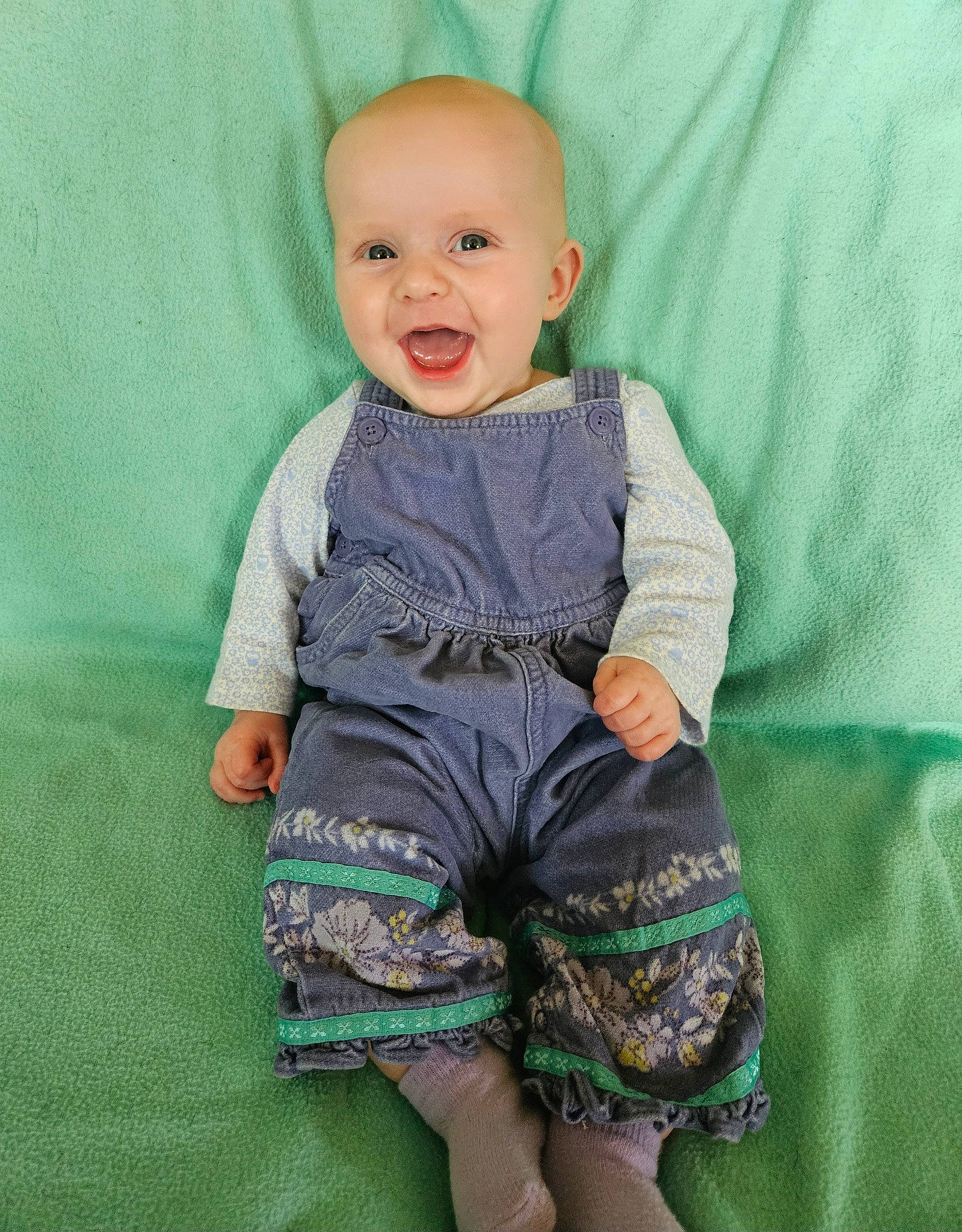 Mabel joined the competition — help win amazing prizes! baby, baby_products, baby_toddler_clothing, child, day_dress, electric_blue, face, happy, head, iris, magenta, neck, pattern, person, sitting, skin, sleeve, smile, t_shirt, toddler