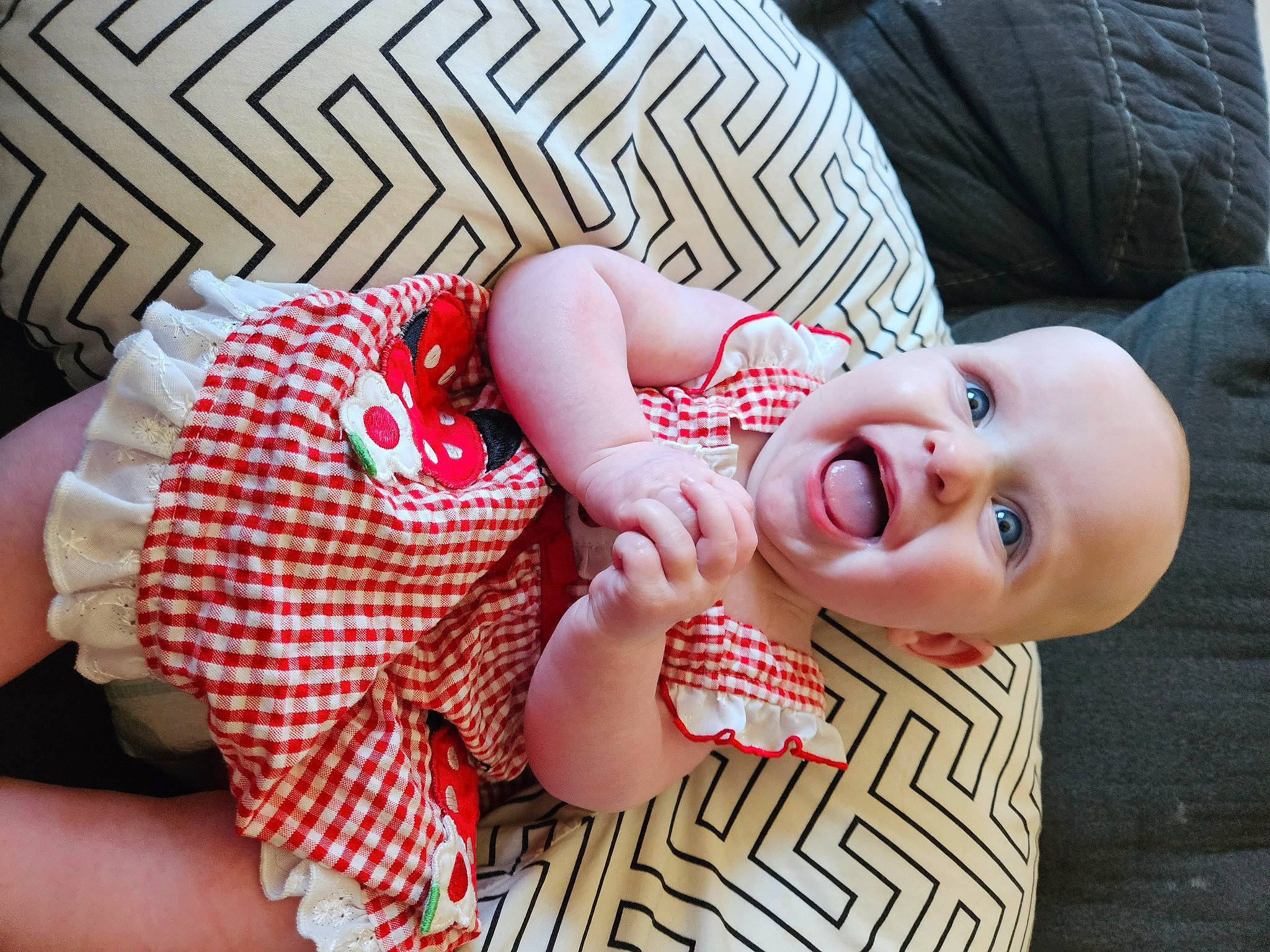 Mabel joined the competition — help win amazing prizes! baby, baby_toddler_clothing, cheek, comfort, eye, face, facial_expression, finger, gesture, happy, head, lip, mouth, nose, pattern, person, pink, skin, sleeve, textile