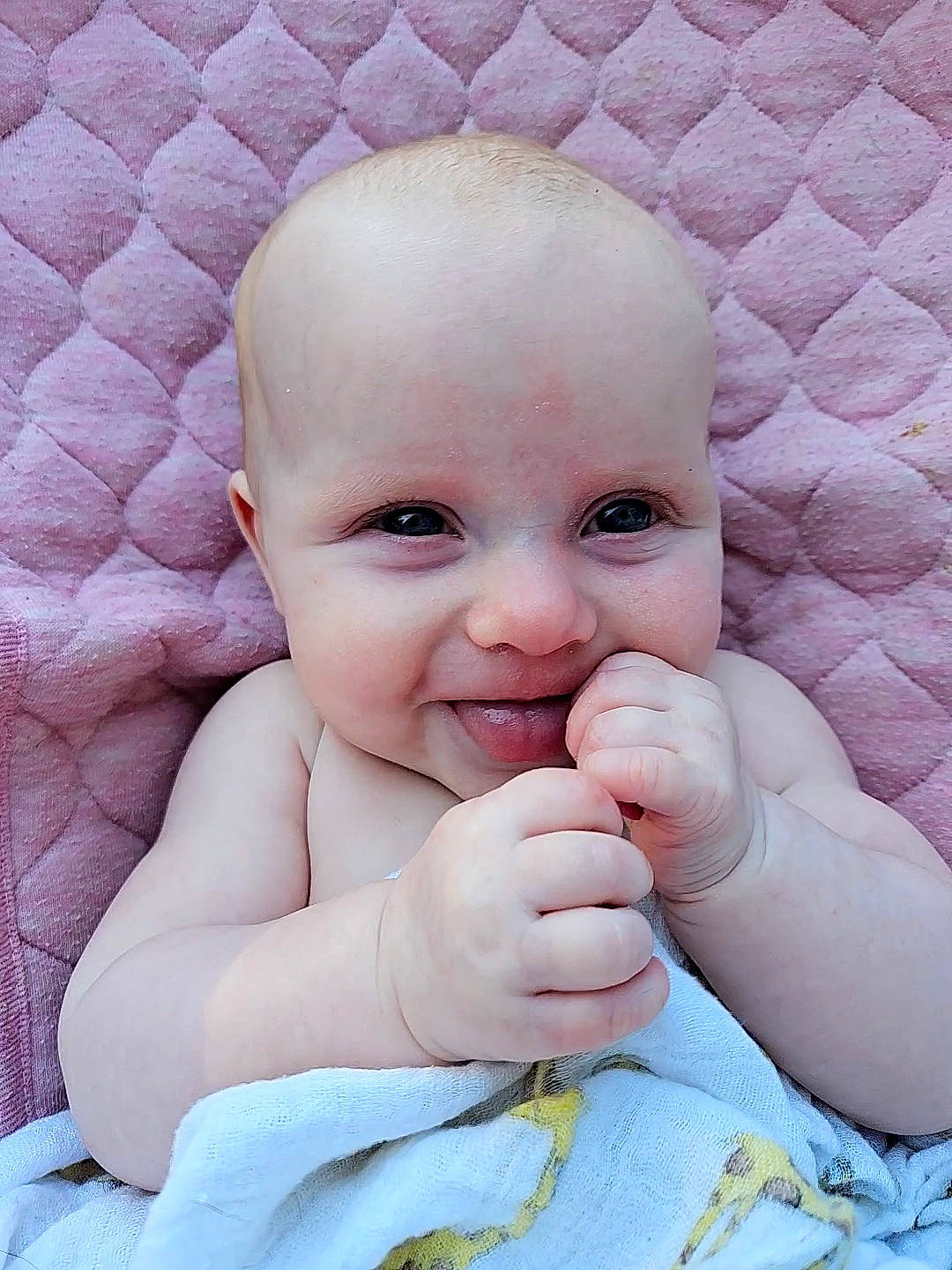 Mabel is registered to the contest to win money with this photo: baby, baby_toddler_clothing, cheek, comfort, eye, eyebrow, facial_expression, finger, gesture, happy, head, lip, nose, person, pink, skin, sleeve, smile, textile, thumb
