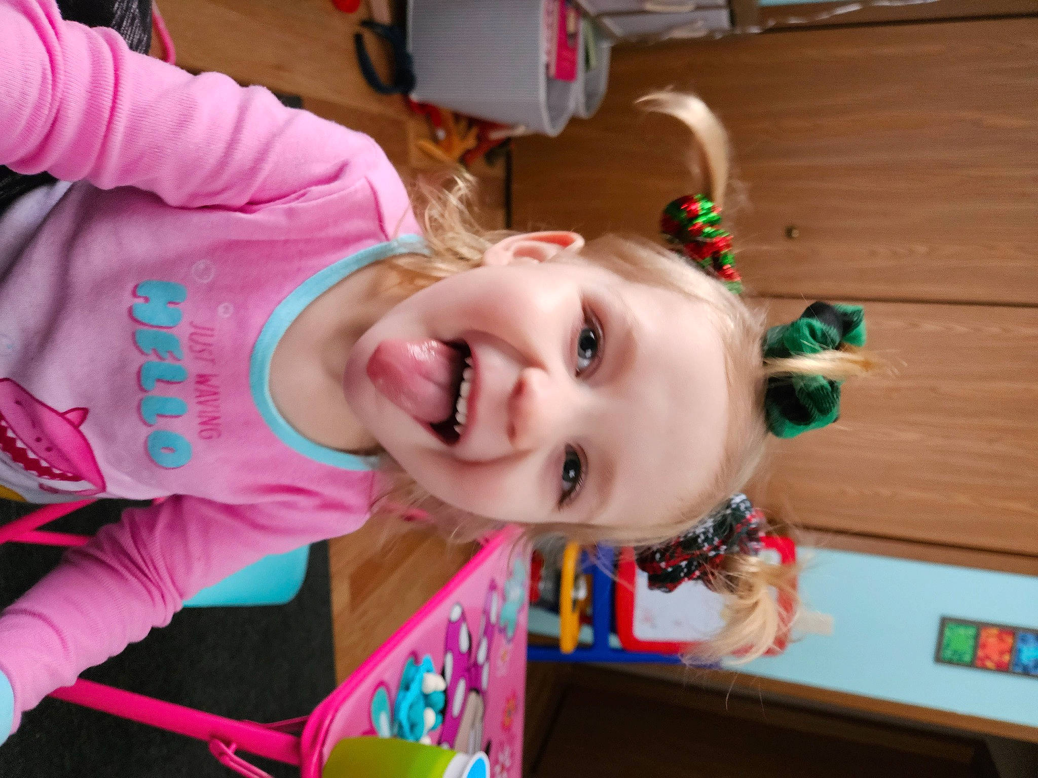 Misty is registered to the contest to win money with this photo: baby_toddler_clothing, cheek, child, event, eye, facial_expression, fun, happy, hardwood, laugh, leisure, magenta, nose, person, product, smile, t_shirt, toddler, vacation, wood