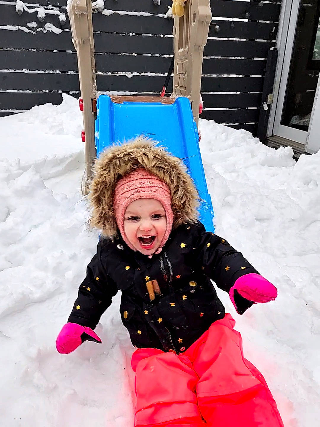 Misty joined the competition — help win amazing prizes! baby_toddler_clothing, child, event, freezing, fun, happy, headwear, leisure, magenta, people_in_nature, person, play, playing_in_the_snow, playing_with_kids, recreation, sitting, sled, sledding, smile, snow