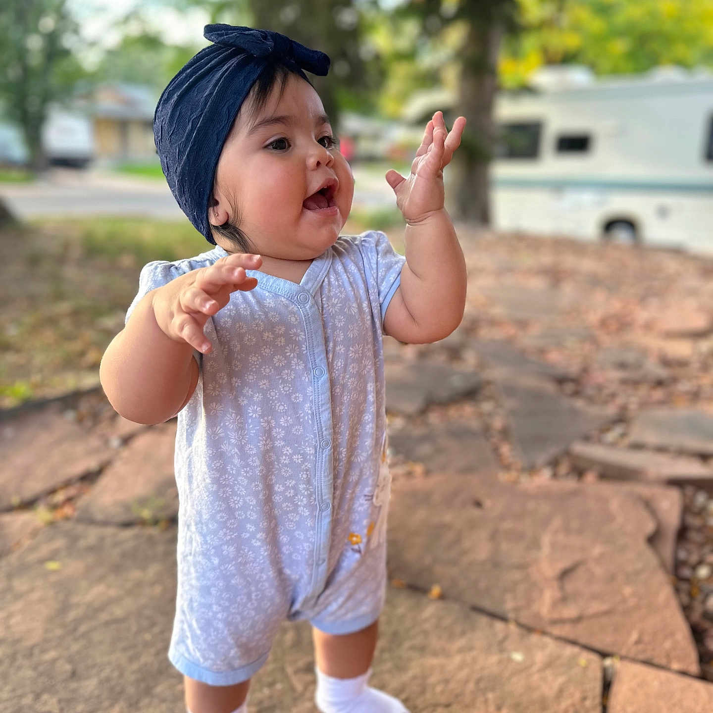 Annabelle joined the competition — help win amazing prizes! baby, bodypart, cap, city, clothing, dress, face, finger, flagstone, hand, hat, head, hosiery, pants, path, person, photography, portrait, sock, walkway