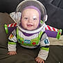 Lennie-Jax is registered to the contest to win money with this photo: baby, buzz_lightyear, child, costume, couch, crawling, cute, face, green, hand, happy, helmet, indoor, infant, person, playful, purple, smiling, toy_story, white