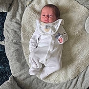 Jak joined the competition — help win amazing prizes! baby, blanket, comfortable, cozy, cute, face, footed_pajamas, gray_blanket, head, indoor, infant, lying_down, newborn, onesie, padded_mat, resting, sleepwear, small_hands, soft, white_clothing
