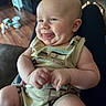 Wylder joined the competition — help win amazing prizes! baby, infant, smiling, tongue_out, sitting, romper, hands, legs, person, indoor, couch, wood_floor, home, happy, cute, child, skin, face, expression, cozy