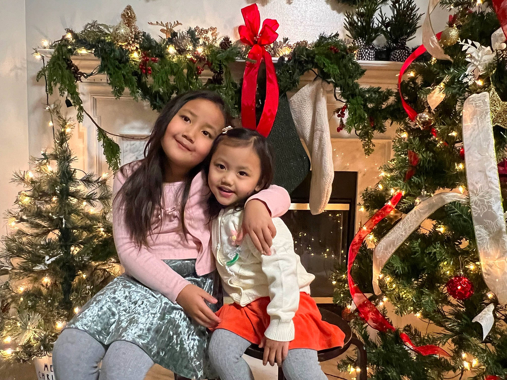 Gracy Sui Mawi is registered to the contest to win money with this photo: christmas_decoration, christmas_ornament, christmas_tree, evergreen, facial_expression, happy, holiday_ornament, human_body, joy, leaf, nature, organ, ornament, people_in_nature, person, photograph, plant, red, smile, standing