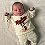 Eliot participe au concours pour gagner de l'argent avec cette photo : baby, blanket, casual, child, clothing, comfortable, cozy, cute, face, indoor, infant, lying_down, mickey_mouse, newborn, pants, person, portrait, smiling, soft_texture, sweater
