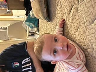 Thimothé a rejoint le concours — aidez-le/la à gagner de superbes lots ! arm, baby, baby_toddler_clothing, cheek, child, ear, eyelash, finger, flooring, gesture, happy, jaw, mouth, neck, nose, person, room, smile, surprise, thumb