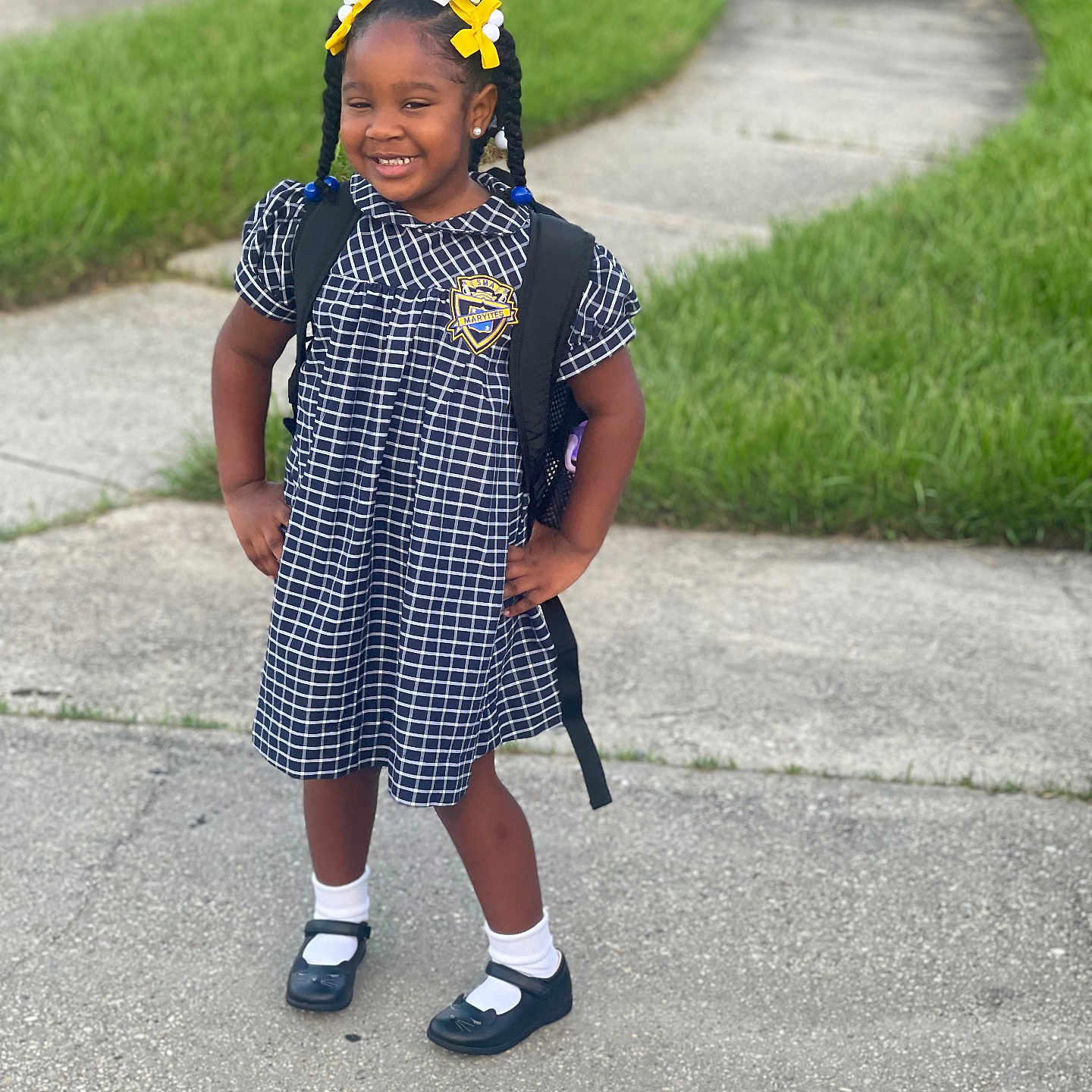 Taraji is registered to the contest to win money with this photo: child, clothing, dress, face, female, footwear, girl, grass, happy, head, path, person, photography, plant, portrait, shoe, sidewalk, smile, walking, walkway