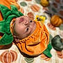ammunition, baby, babylaughing, blanket, face, grenade, happy, head, person, photography, portrait, smile, weapon, yawning