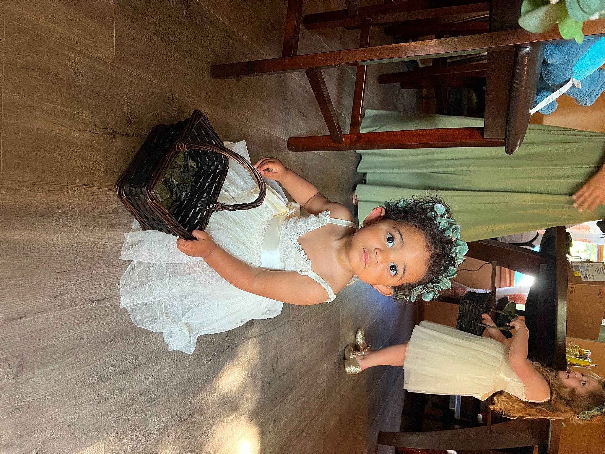 Ariya is registered to the contest to win money with this photo: bridal_clothing, child, event, flash_photography, flooring, fun, happy, hardwood, person, room, toddler, tradition, wedding_dress, wood, wood_flooring