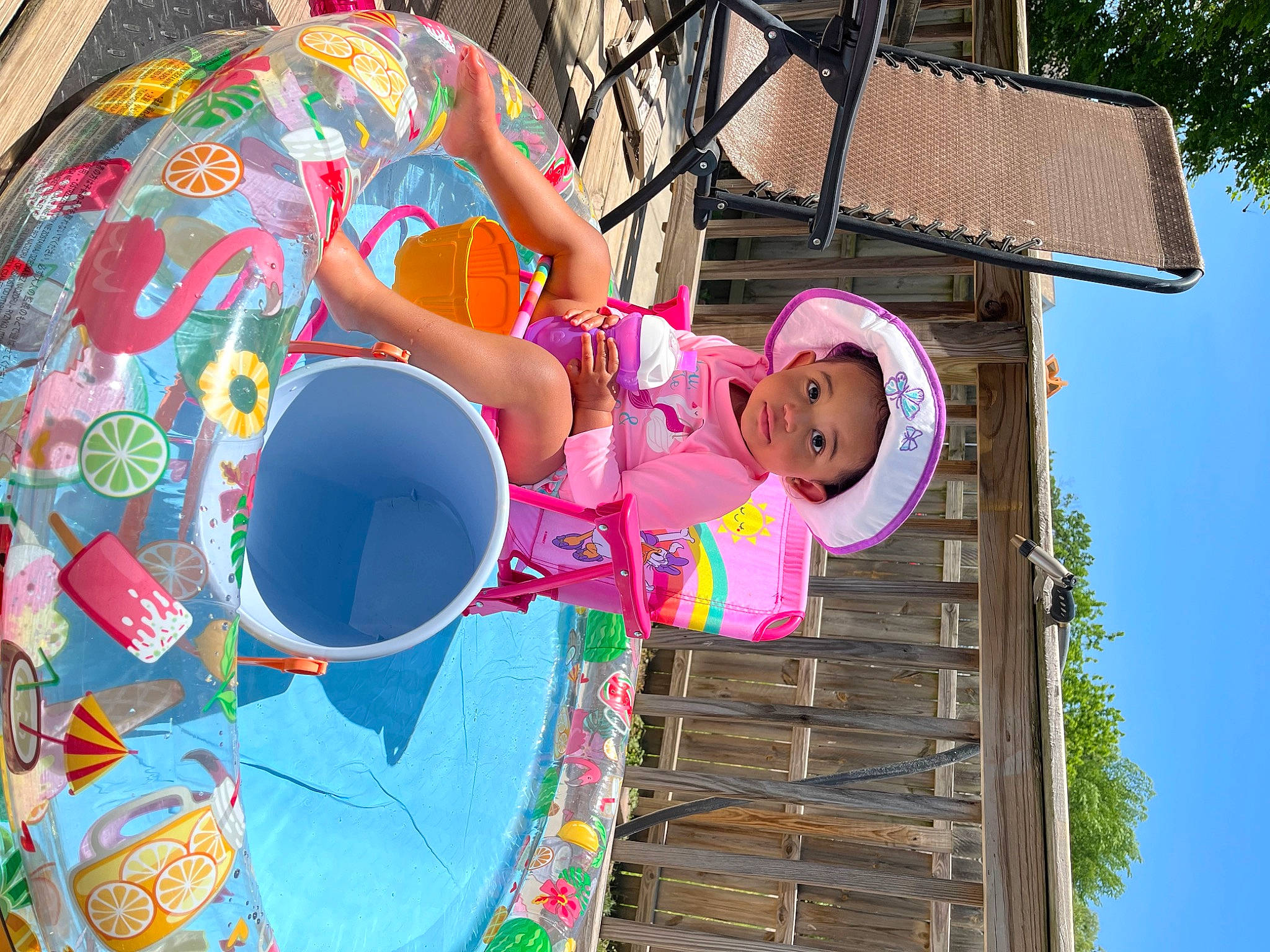 Ariya is registered to the contest to win money with this photo: baby_toddler_clothing, child, fun, happy, hat, human_settlement, leisure, magenta, pattern, person, pink, play, public_space, recreation, sky, spring, sun_hat, t_shirt, toddler, tree