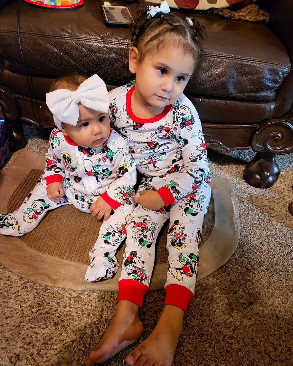 Nova is registered to the contest to win money with this photo: baby, baby_toddler_clothing, child, comfort, couch, event, face, facial_expression, flooring, foot, fun, hairstyle, happy, headwear, human_body, lap, living_room, person, shoe, sleeve