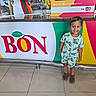 Addiel joined the competition — help win amazing prizes! child, toddler, smiling, happy, portrait, standing, dinosaur_clothing, sandals, ice_cream_shop, counter, restaurant, colorful, indoor, 商店, branding, food_service, reflection, tile_floor, employee, bon