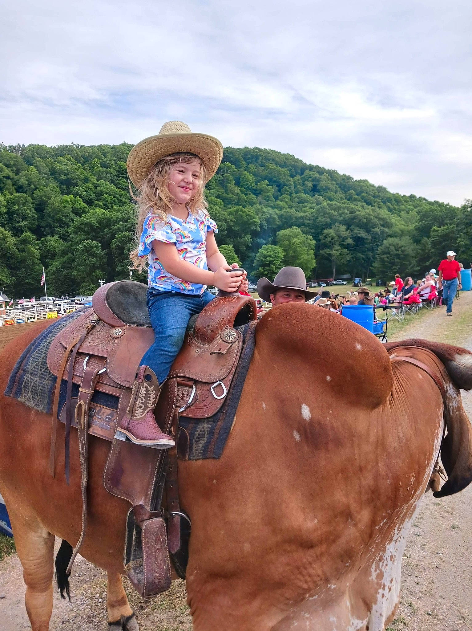 Skarlett is registered to the contest to win money with this photo: bridle, cloud, equestrianism, halter, hat, headwear, horse, horse_supplies, horse_tack, joy, landscape, leisure, mane, outdoor_recreation, person, recreation, rein, saddle, sky, sun_hat