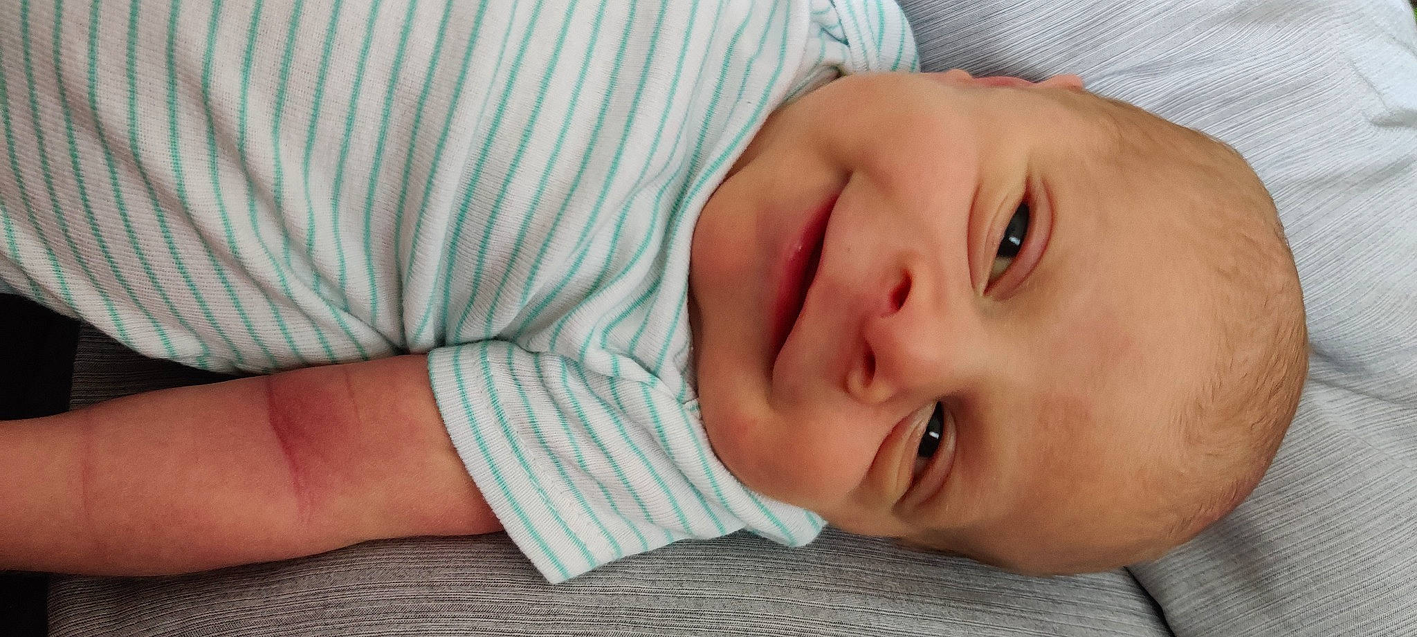 Aiden is registered to the contest to win money with this photo: baby, baby_toddler_clothing, cheek, child, collar, comfort, elbow, eyelash, finger, happy, iris, joy, lip, nose, pattern, person, portrait_photography, sitting, skin, sleeve