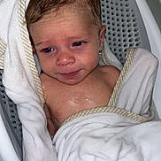 Rowan joined the competition — help win amazing prizes! baby, towel, bath, wet, infant, face, skin, head, expression, water, bathtub, seat, striped, cloth, child, person, young, indoors, cute, wrapped