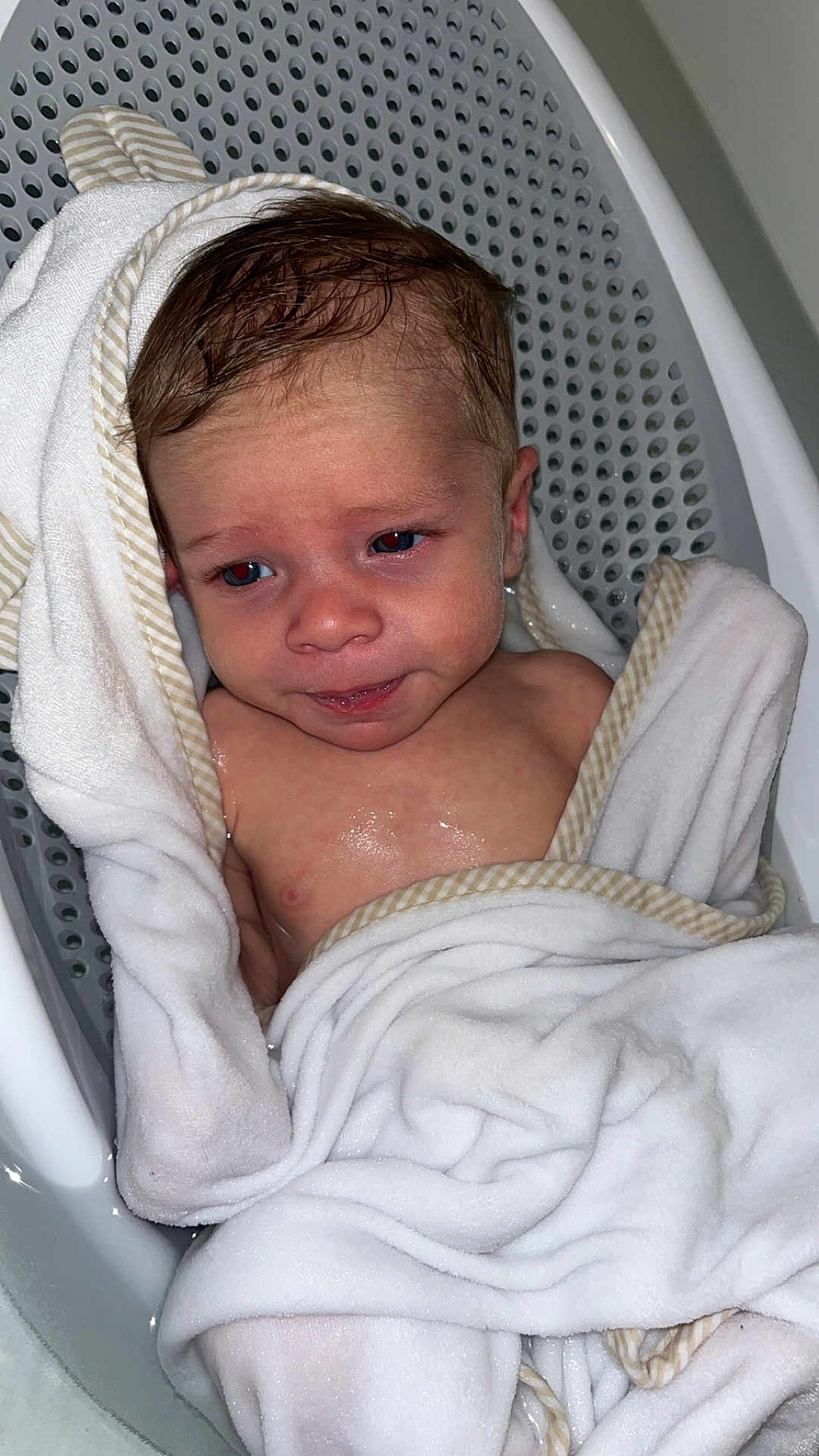 Rowan joined the competition — help win amazing prizes! baby, towel, bath, wet, infant, face, skin, head, expression, water, bathtub, seat, striped, cloth, child, person, young, indoors, cute, wrapped
