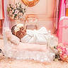 baby, infant, sleeping, portrait, swaddled, white_blanket, headband, flower, pink, vintage, telephone, suitcase, nursery, lace, cushion, soft_lighting, indoor, decorative, photography, peaceful
