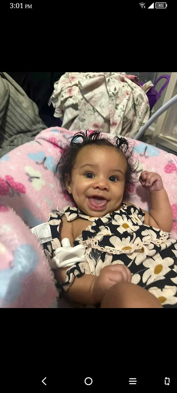 Leiloni Braziel joined the competition — help win amazing prizes! baby, smiling, happy, infant, blanket, butterflies, curly_hair, face, person, clothing, black_and_white, floral_pattern, cute, indoors, soft_texture, child, cute_outfit, cozy, lying_down, closeup