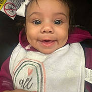 Leiloni Braziel is registered to the contest to win money with this photo: baby, child, face, smile, dimple, bow, bib, drool, clothing, hoodie, happy, infant, portrait, closeup, cute, person, indoor, expression, young, joyful