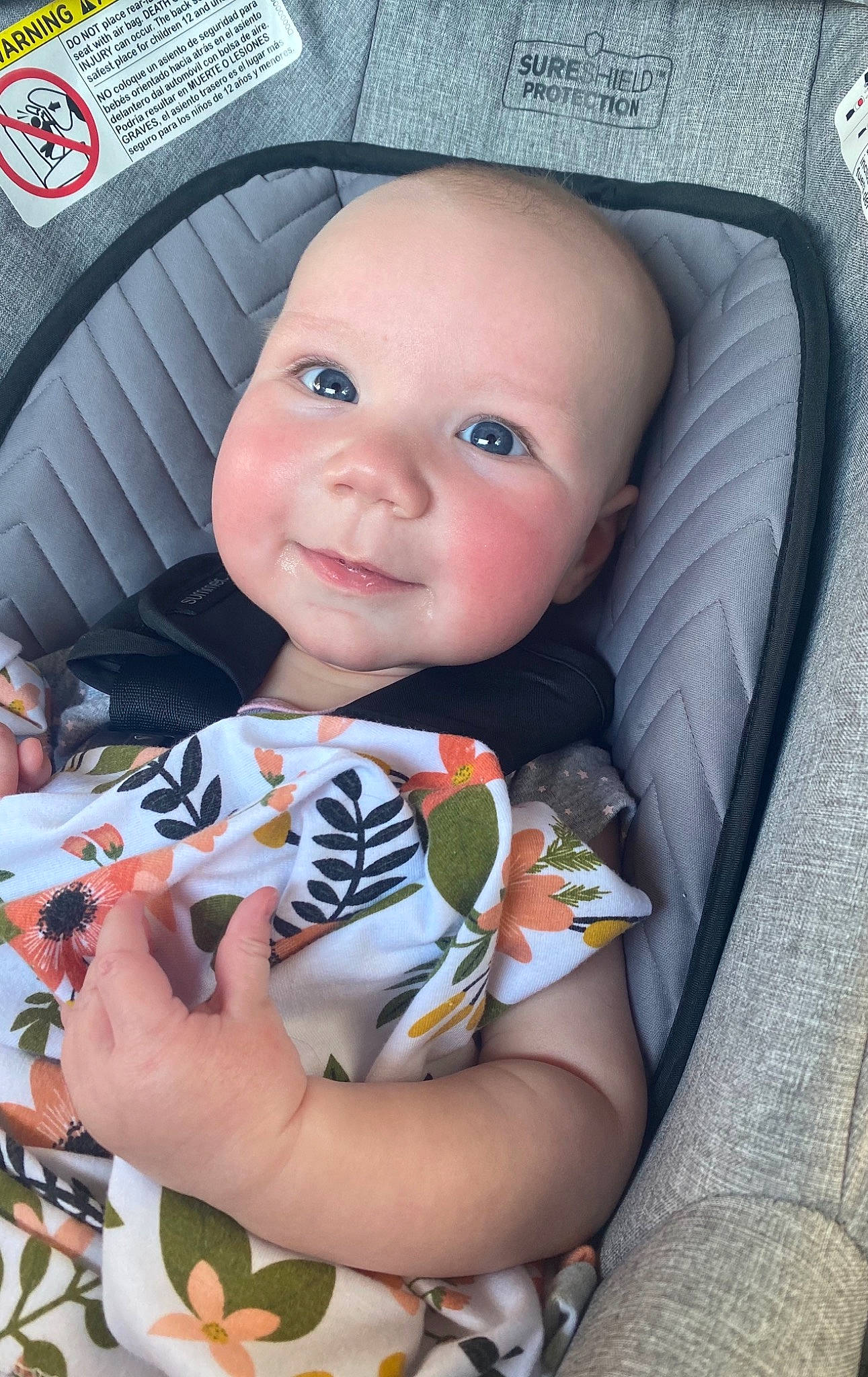 Hadlee is registered to the contest to win money with this photo: auto_part, baby, baby_carriage, baby_products, baby_safety, baby_toddler_clothing, car_seat, cheek, child, eye, finger, happy, head, lip, mouth, person, product, sitting, skin, smile