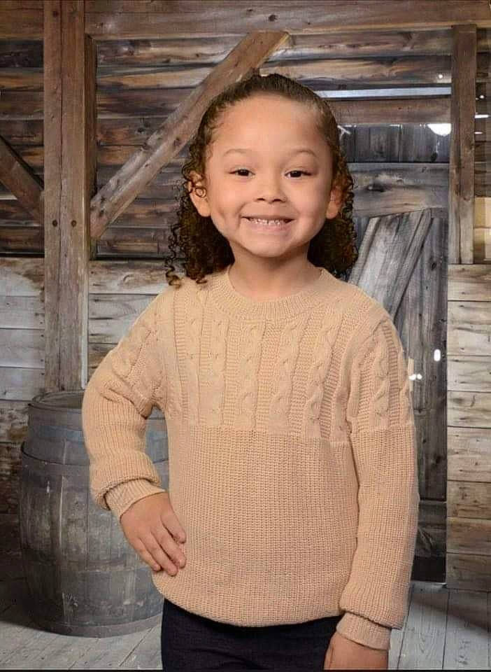 Khaleesia is registered to the contest to win money with this photo: brown_hair, child, chin, clothing, face, fashion_design, flash_photography, hair, hairstyle, happy, human_body, iris, joy, neck, pattern, person, skin, sleeve, smile, standing