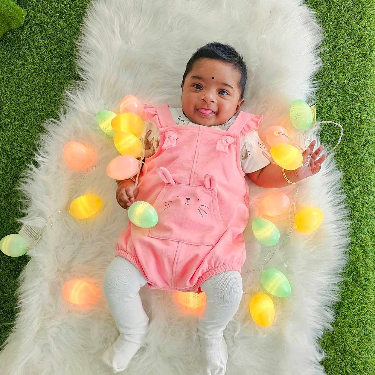 Ananyaa is registered to the contest to win money with this photo: baby, balloon, blanket, clothing, coat, cushion, face, furniture, glove, grass, happy, head, homedecor, outdoors, people, person, photography, plant, portrait, smile