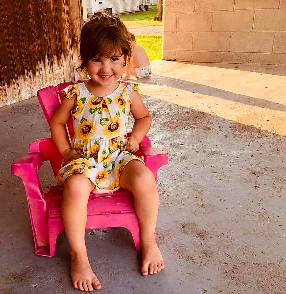 Hadley is registered to the contest to win money with this photo: barefoot, beauty, child, child_model, dress, human_leg, joy, leg, pattern, person, pink, play, sitting, sleeve, summer, thigh, toddler, vacation