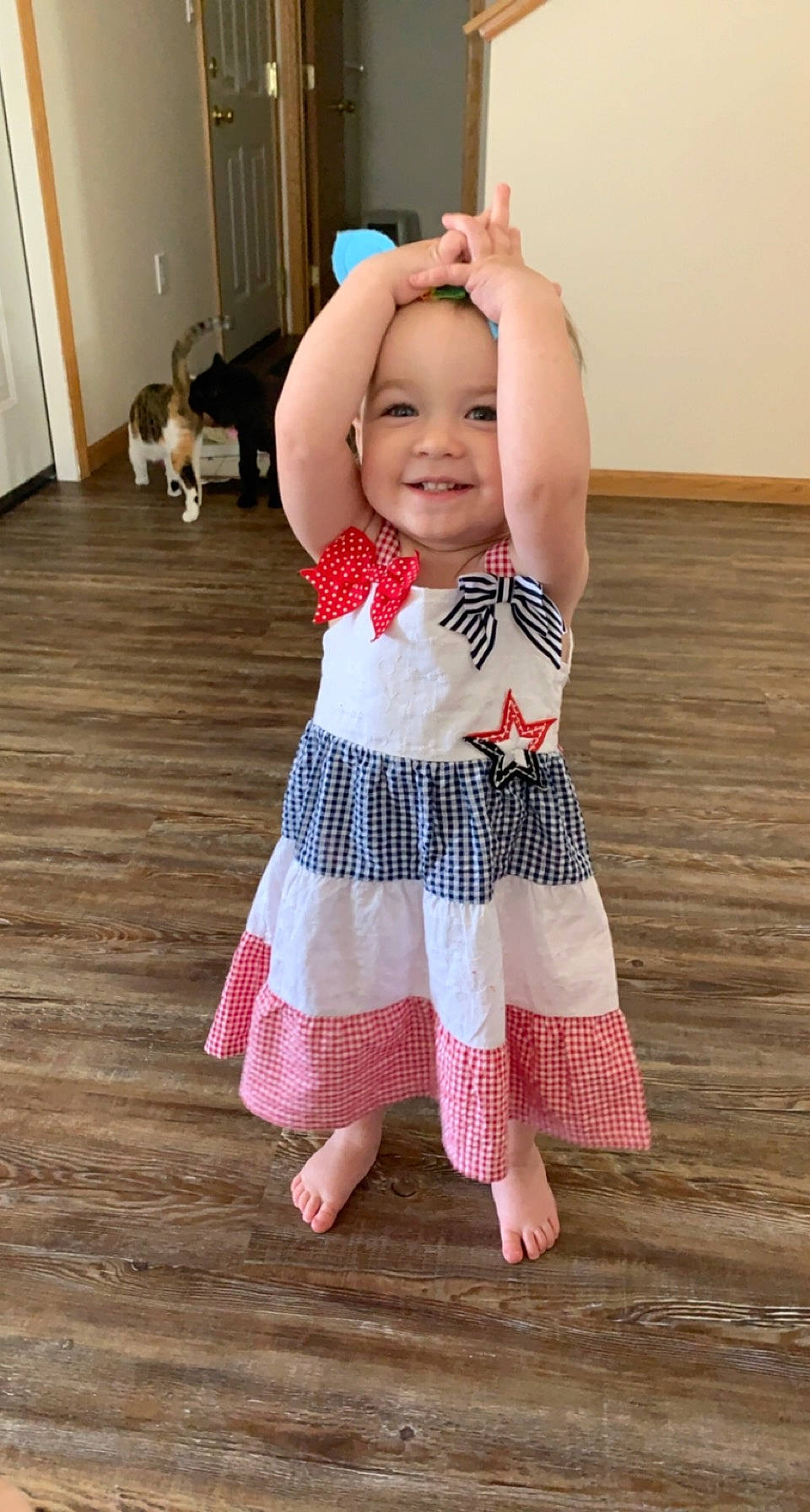 Lizzie joined the competition — help win amazing prizes! baby, baby_toddler_clothing, door, dress, eye, face, fawn, flooring, happy, head, headgear, headwear, iris, joy, one_piece_garment, person, pink, skin, sleeve, smile