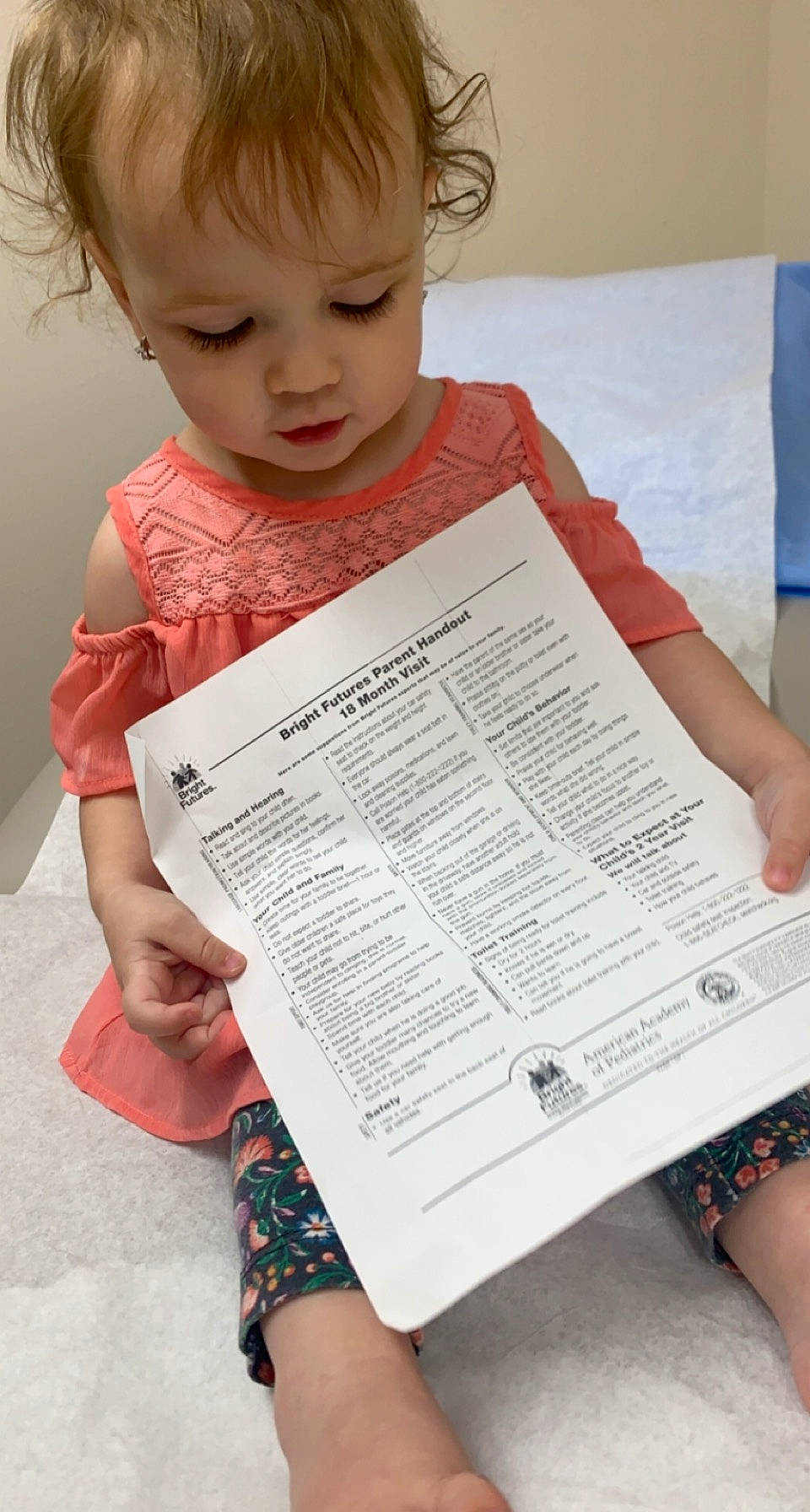 Lizzie is registered to the contest to win money with this photo: baby_toddler_clothing, child, eyelash, finger, font, gesture, hairstyle, hand, human, human_body, joint, nose, organ, people, person, photograph, product, red, toddler, white