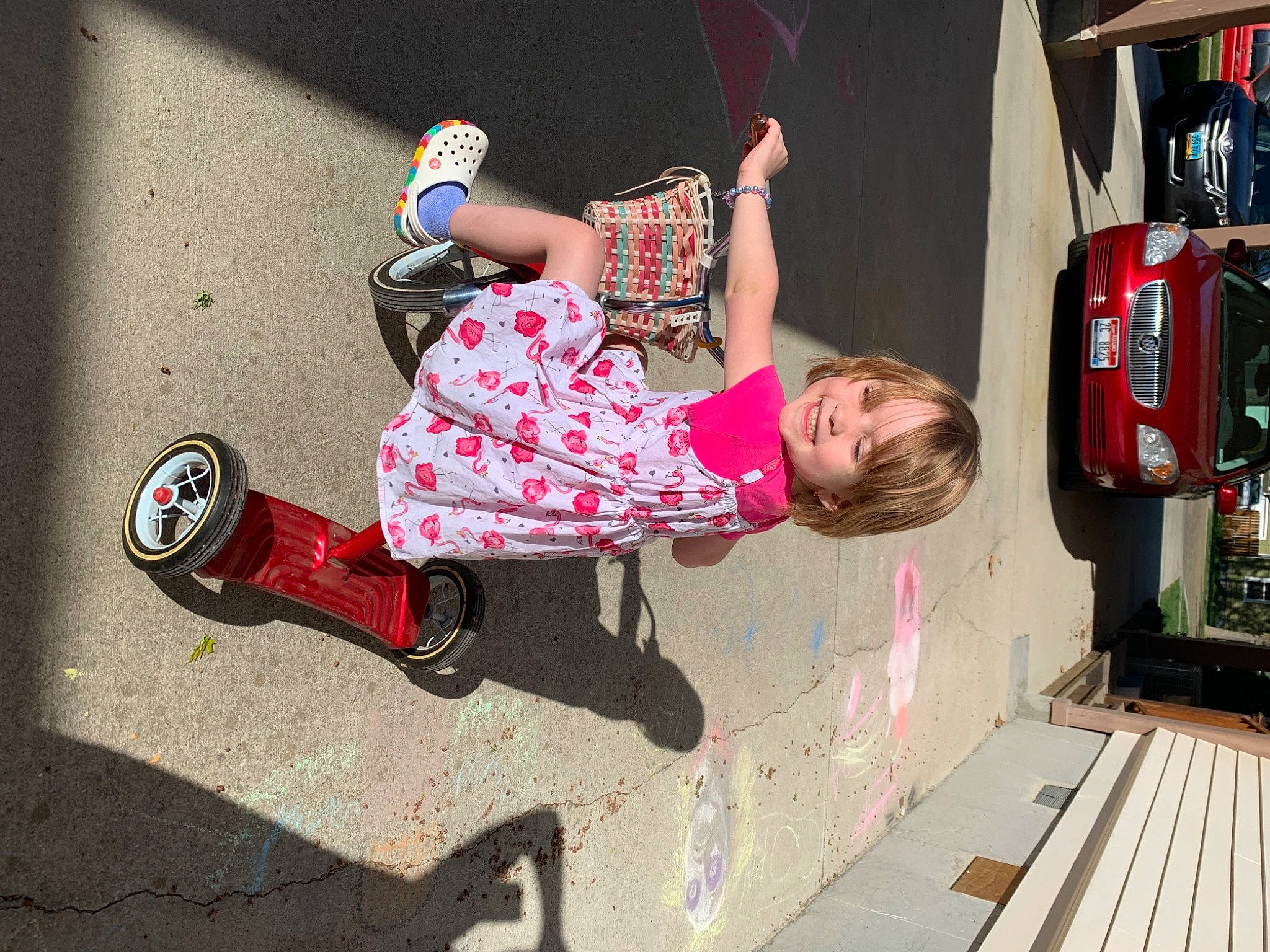 Ember is registered to the contest to win money with this photo: automotive_lighting, car, carmine, child, cool, fun, joy, leisure, motor_vehicle, person, pink, public_space, rolling, shoe, shorts, sneakers, street_fashion, tire, toddler, vehicle_door