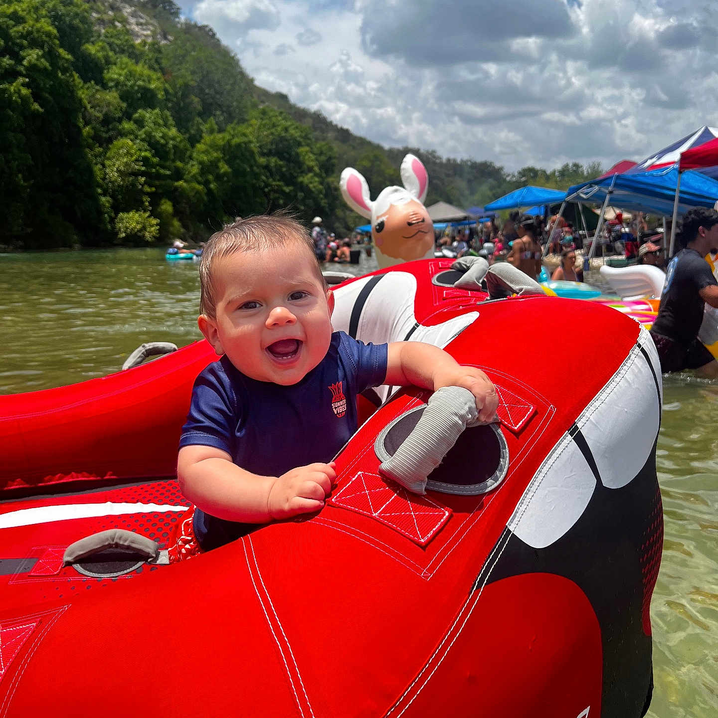 Aj. is registered to the contest to win money with this photo: accessories, baby, boat, clothing, face, head, inflatable, jewelry, lake, lifejacket, necklace, outdoors, person, photography, portrait, summer, transportation, vehicle, vest, water