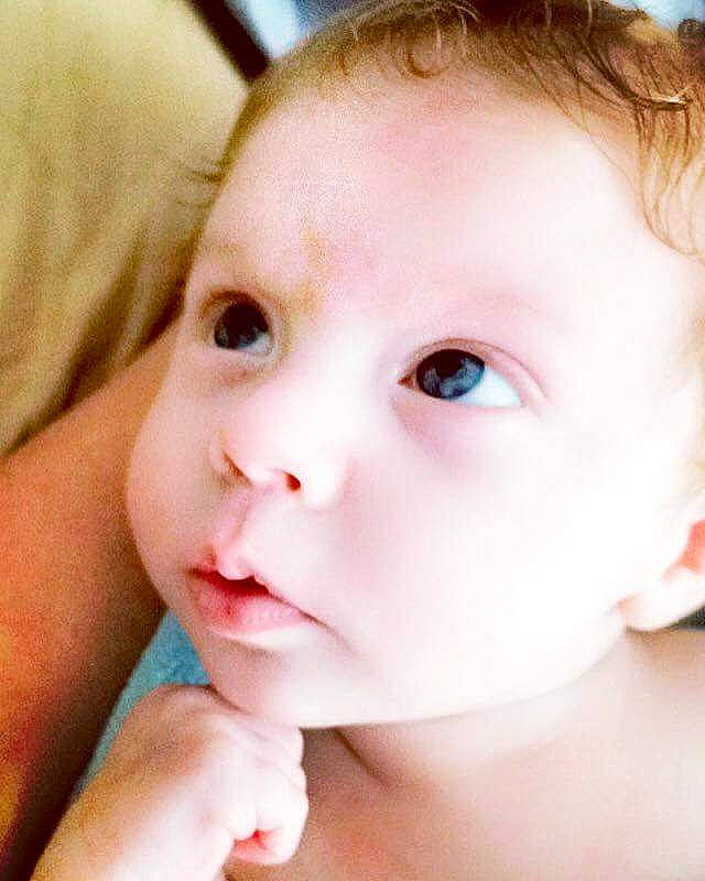 Cale is registered to the contest to win money with this photo: baby, cheek, child, close_up, ear, eyebrow, eyelash, forehead, gesture, happy, human_body, iris, jaw, lip, mouth, neck, no_expression, nose, person, skin