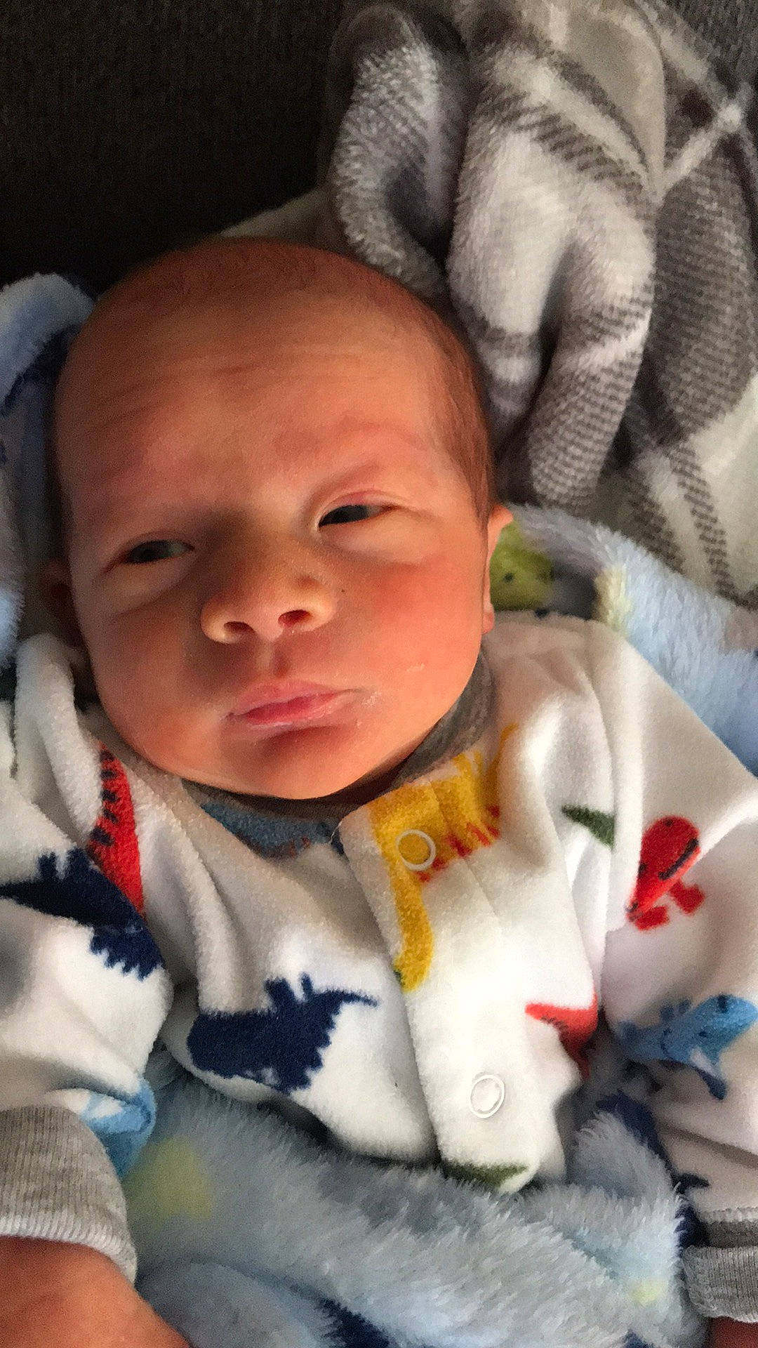 Bryan is registered to the contest to win money with this photo: baby, baby_toddler_clothing, cheek, chin, comfort, eye, eyebrow, eyelash, face, finger, forehead, iris, lip, mammal, mouth, nose, person, product, skin, vertebrate