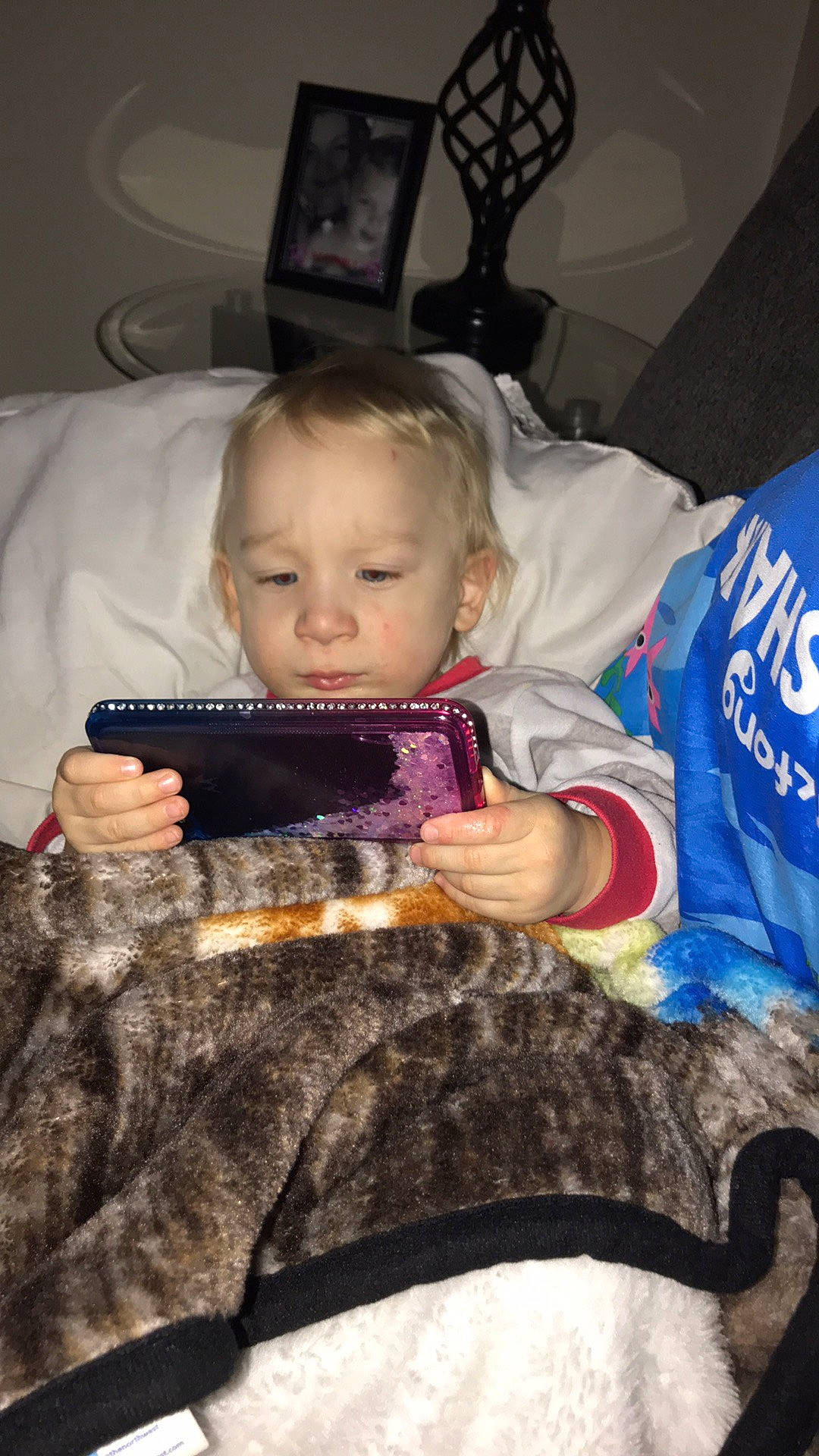 Leland is registered to the contest to win money with this photo: baby, baby_carriage, baby_products, baby_toddler_clothing, chair, cheek, child, comfort, event, facial_expression, fun, fur, happy, iris, lap, person, room, sitting, skin, toddler