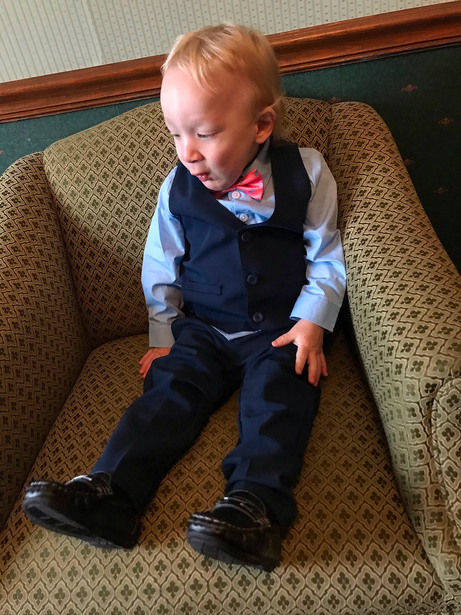 Leland is registered to the contest to win money with this photo: baby, baby_toddler_clothing, child, collar, comfort, couch, face, floor, flooring, hair, hardwood, joint, leg, person, shoe, sitting, sleeve, sneakers, tie, toddler